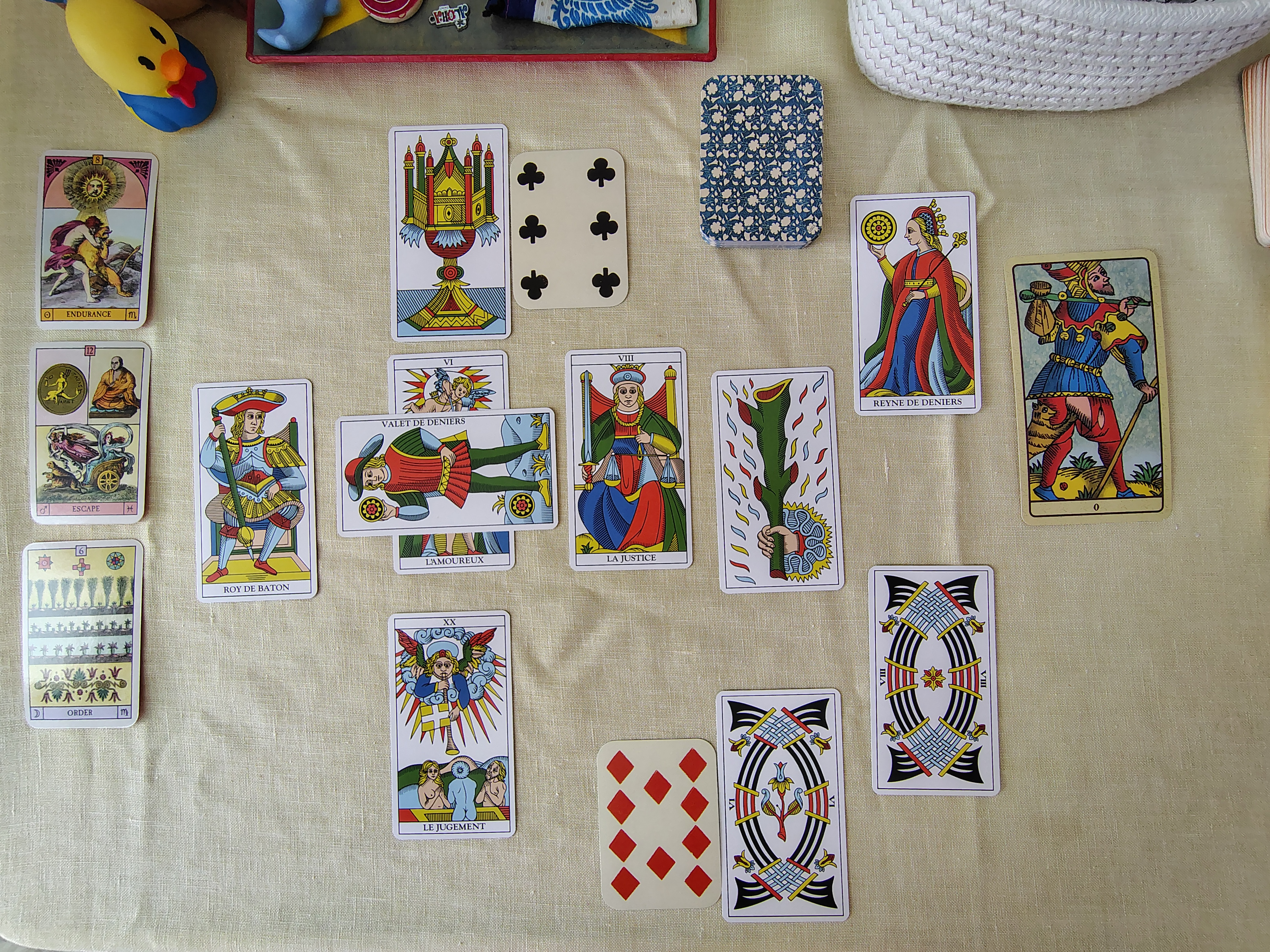 Celtic Cross with oracle cards (left column) and playing cards (within the spread) showing a possible way of using them. Celtic Cross spread with Oracle cards and Playing cards.